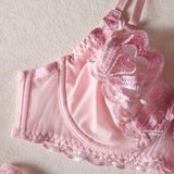 Ensemble porte-jarretelle rose avec string ouvert